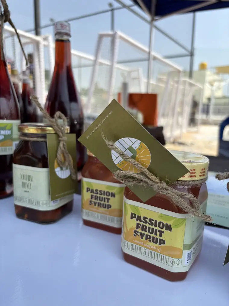 Passion fruit syrup and other bottles on a stall table