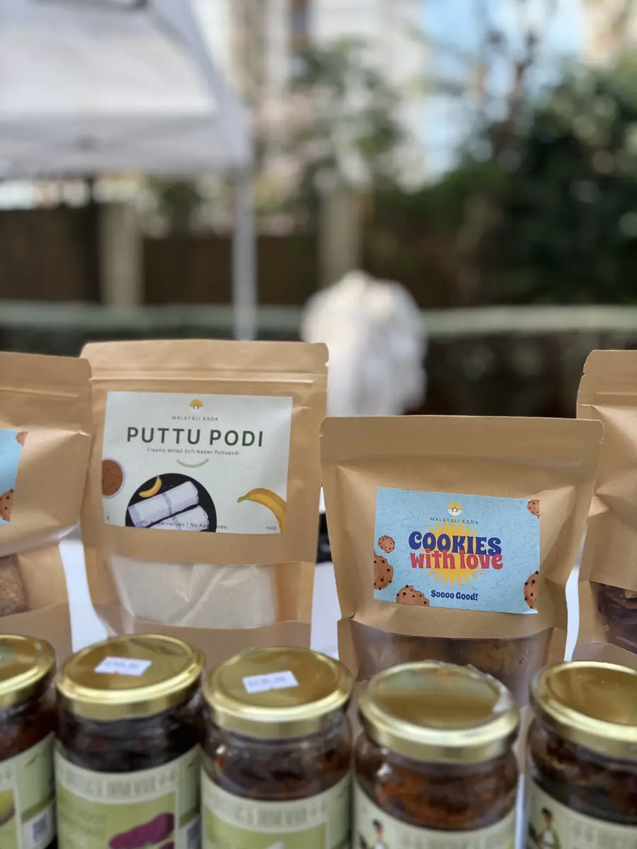 A stall table with labelled pouches and jars
